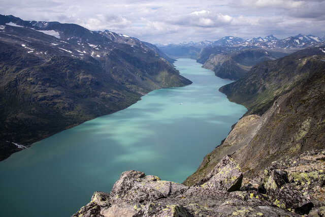 Aerial View of Lake Gjende Surrounded by Mountains in Norway