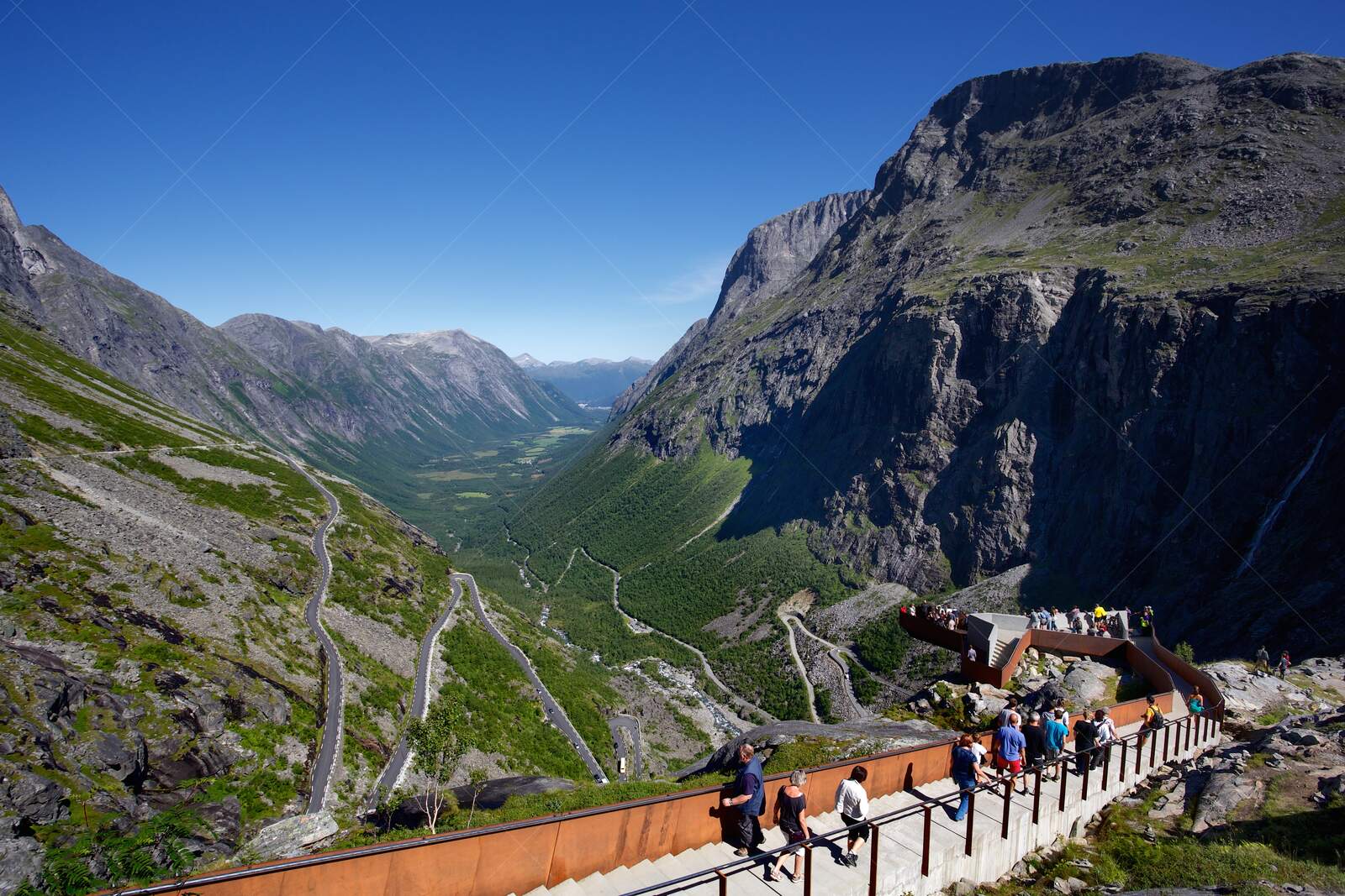 Tourists walking along Trollstigen viewpoint in Norway