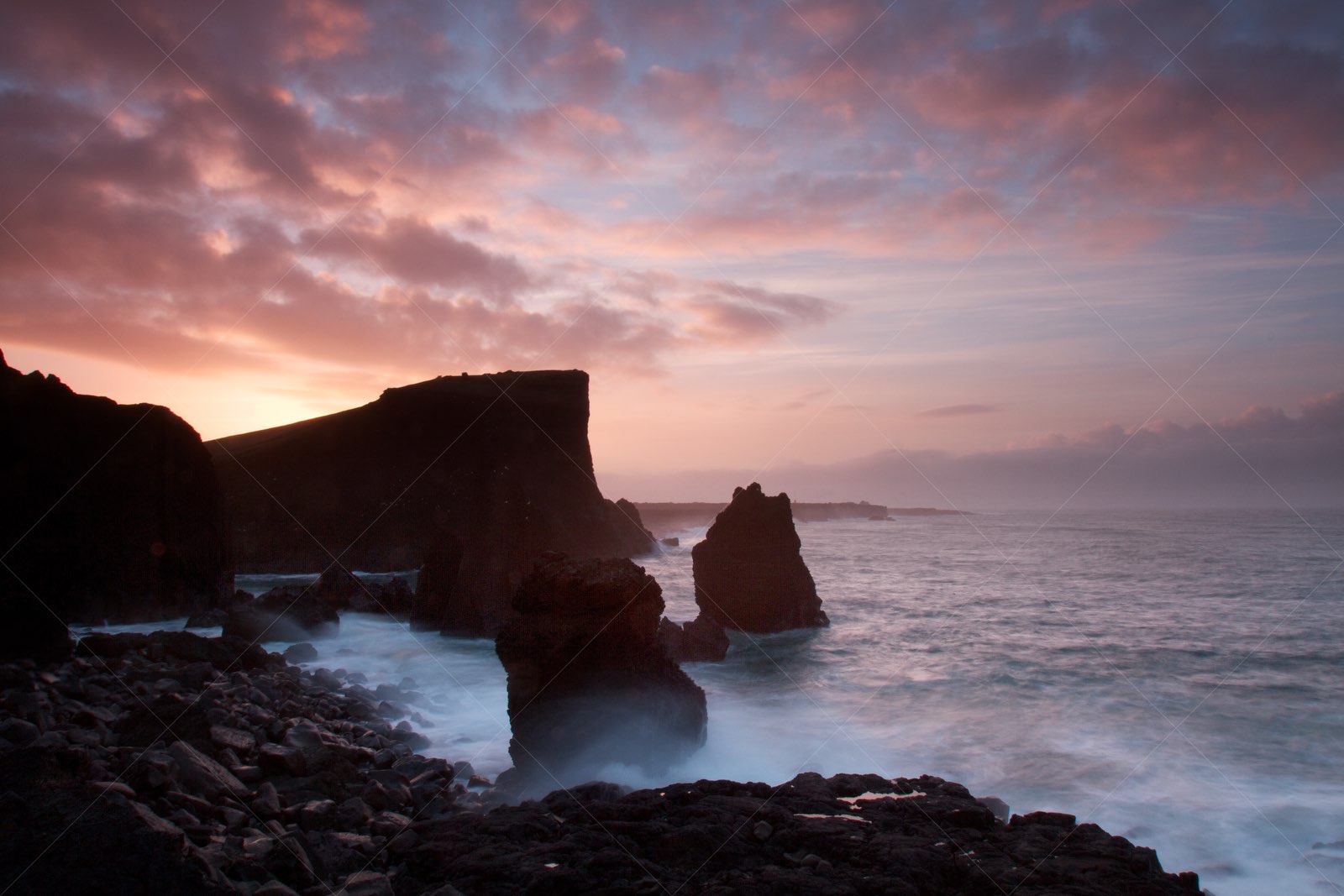 Sunset over Valahnúkamöl rocky coastline in Iceland