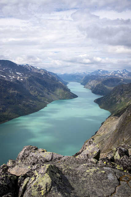 Stunning turquoise lake surrounded by mountains in Norway