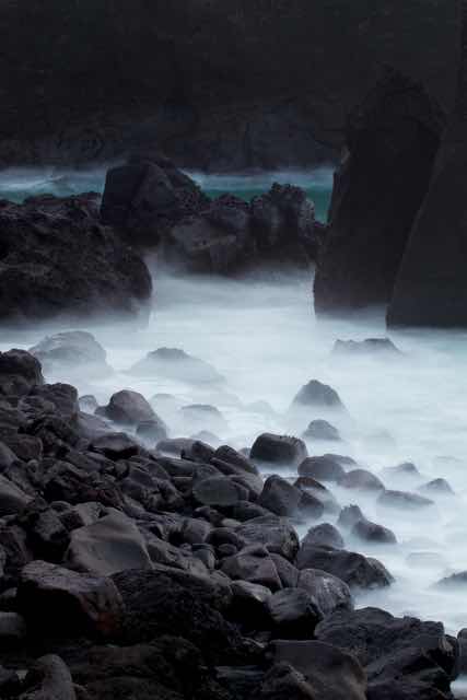 Misty rocky shoreline at Reykjanestá Iceland