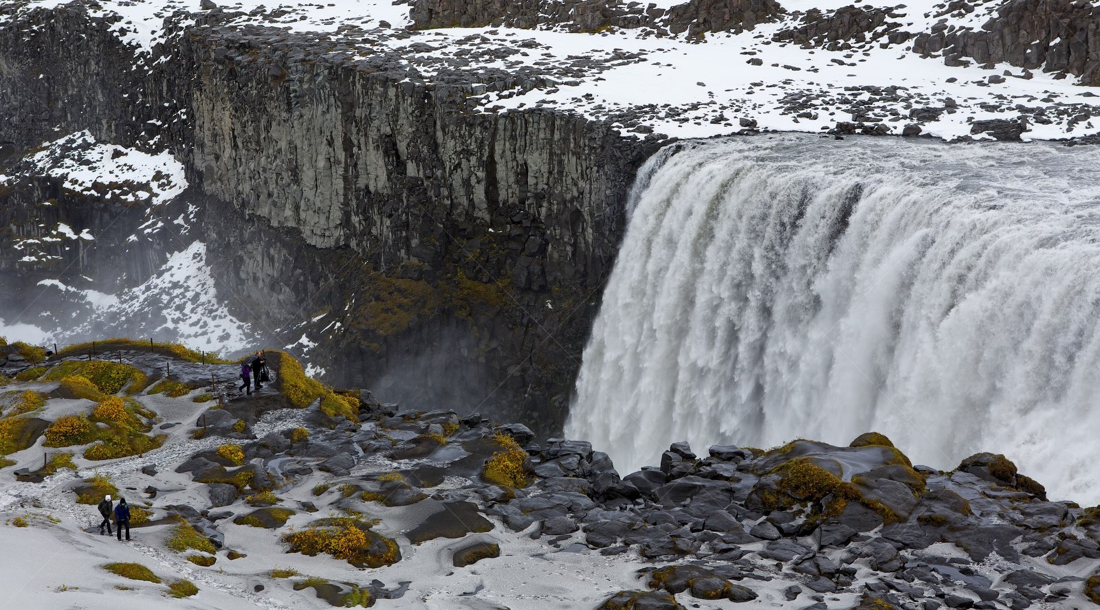 Dettifoss waterfall in Iceland with snowy cliffs
