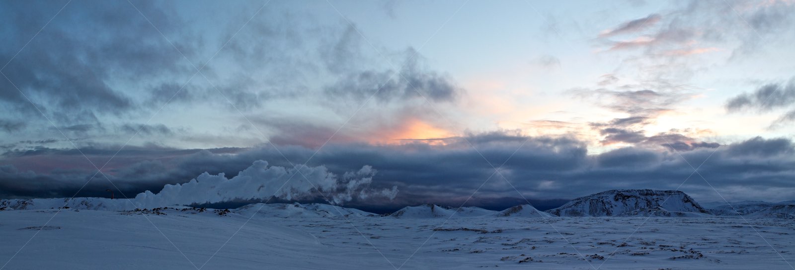 Winter sunset over snowy Icelandic landscape
