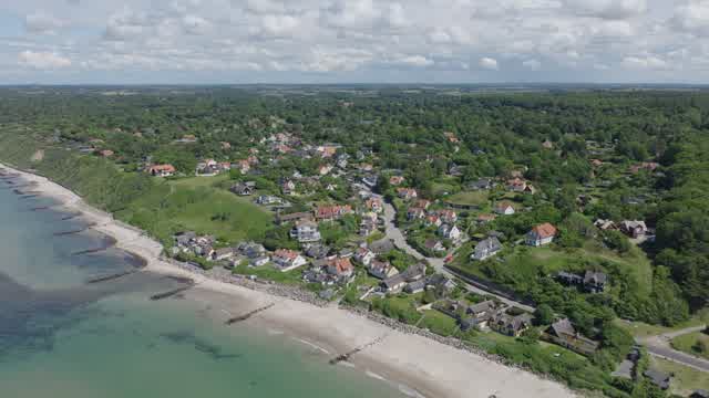 Aerial drone footage of coastal village in Tisvildeleje Denmark