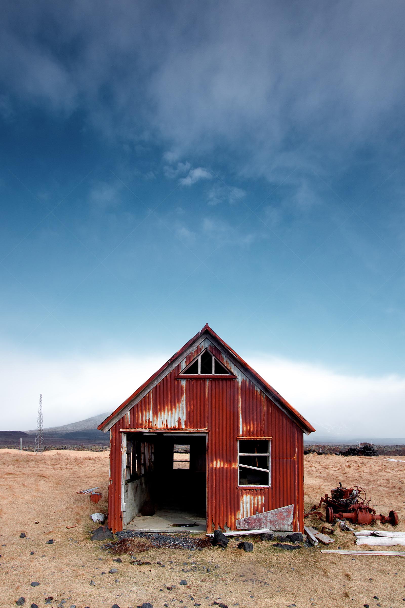 Rusty abandoned barn in rural landscape