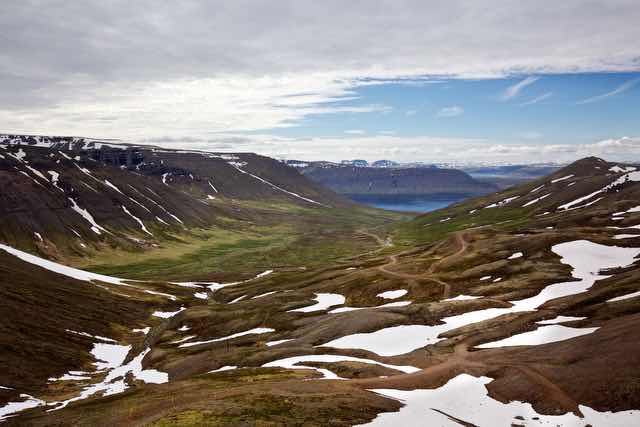 Westfjords valley with snow patches in Ísafjarðarbær Iceland