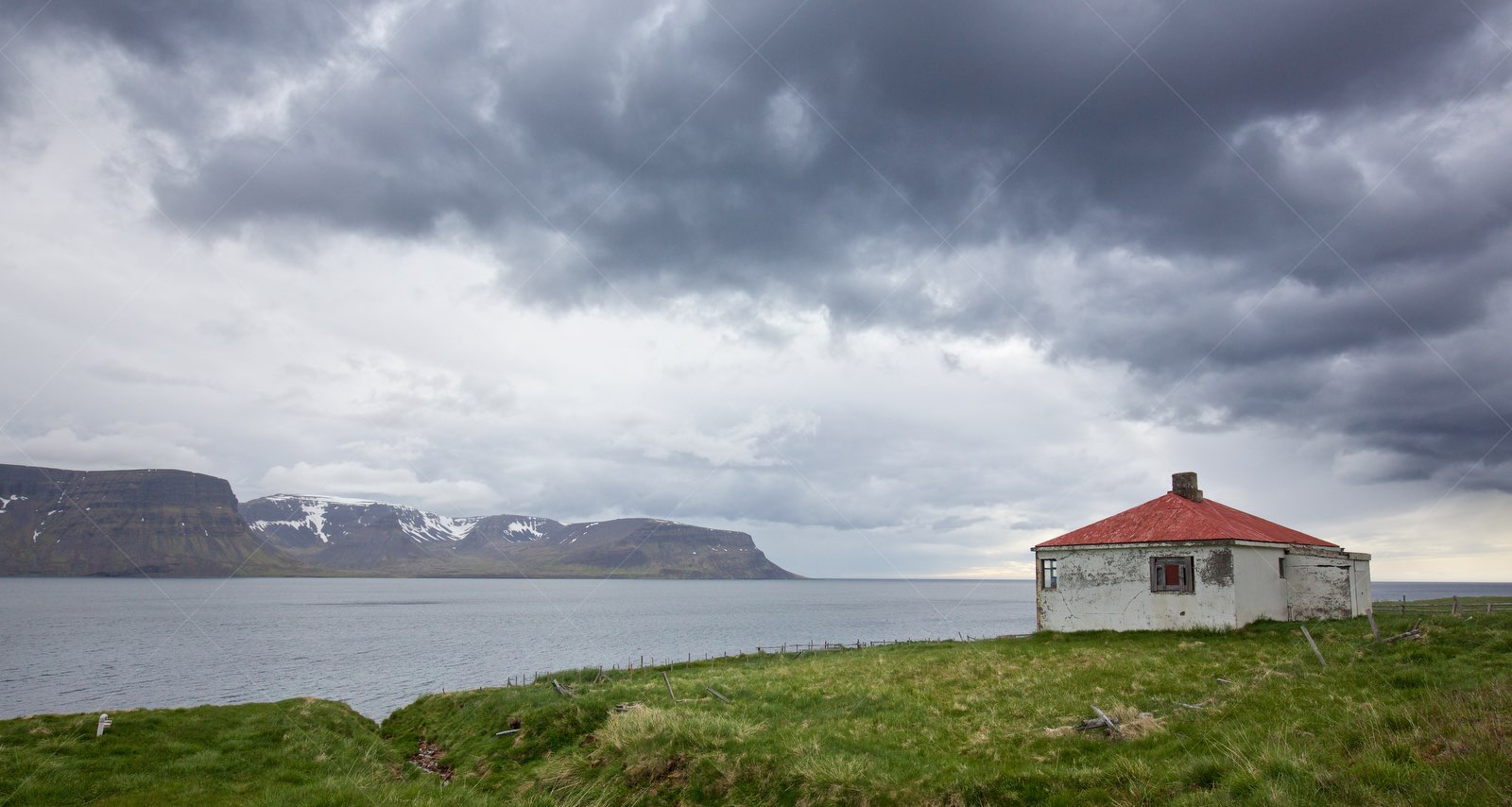 Abandoned house by fjord in Ísafjarðarbær Iceland
