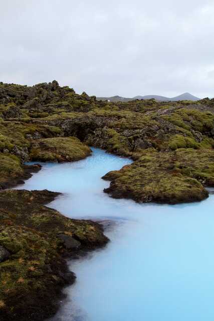 Milky Blue Lagoon Lagoon in Iceland with Mossy Lava Rocks