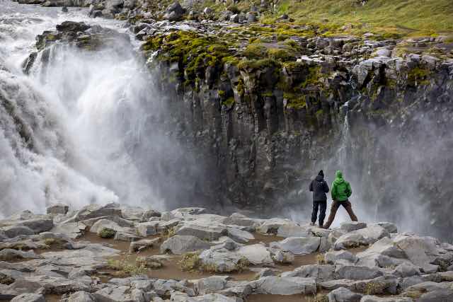 Tourists Viewing Dettifoss Waterfall in Iceland