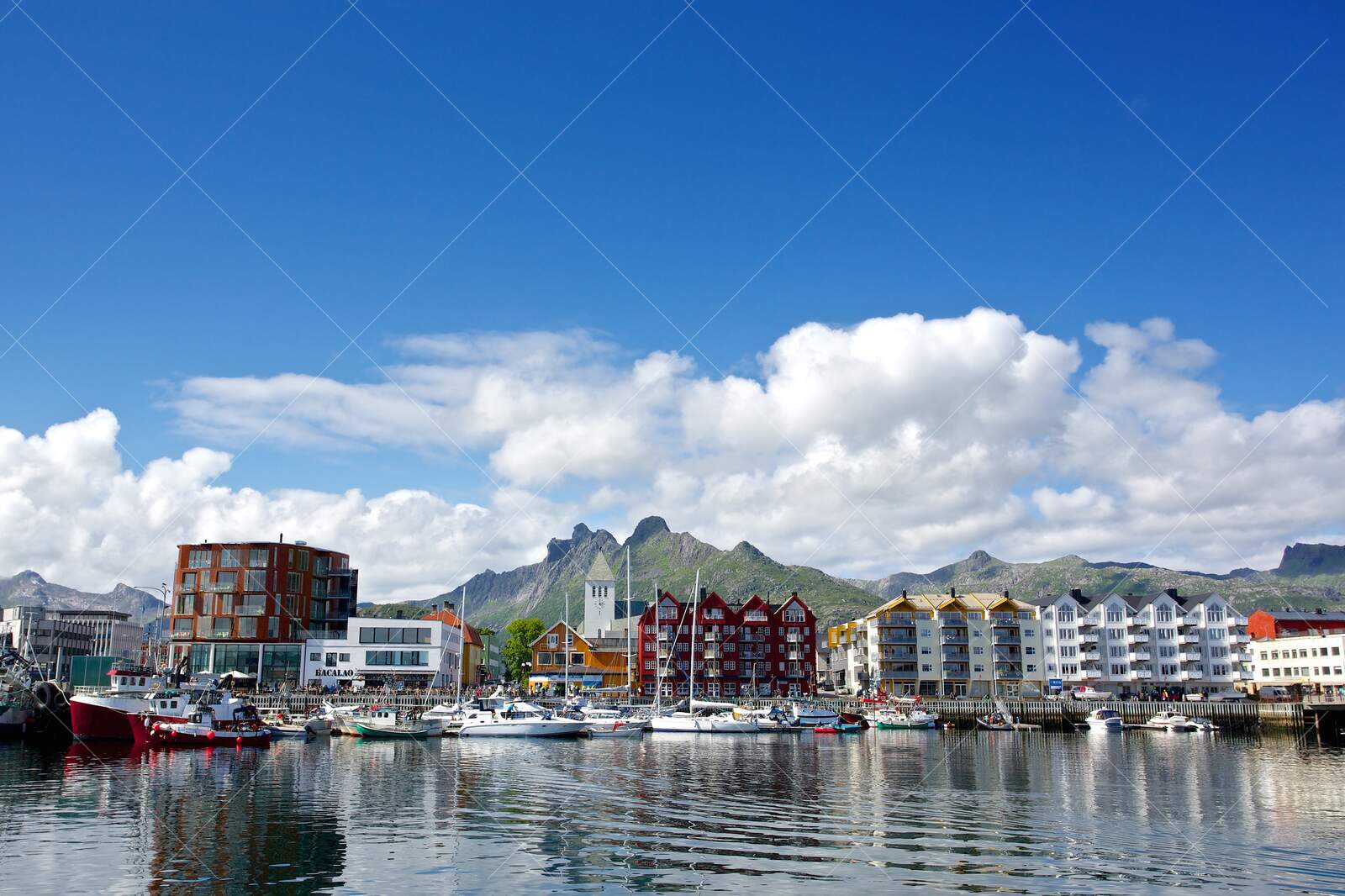 Harbor view of colorful buildings and boats in Svolvær Norway
