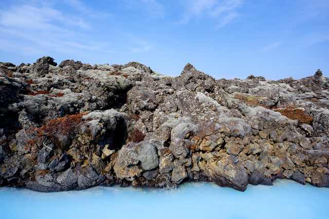 Lava rocks and turquoise water at the Blue Lagoon Iceland